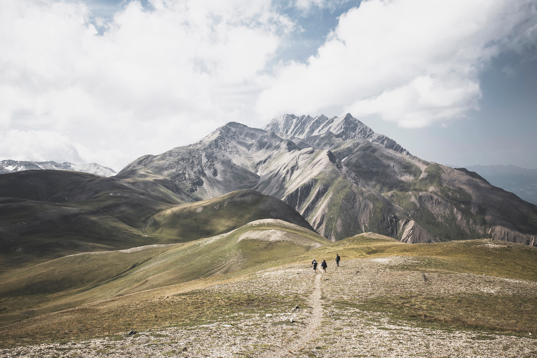 Green and Brown Mountain Under White Cloudy Sky Photo